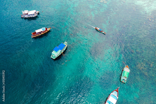 Top view of yachts and divers in the blue water of the sea. © watman