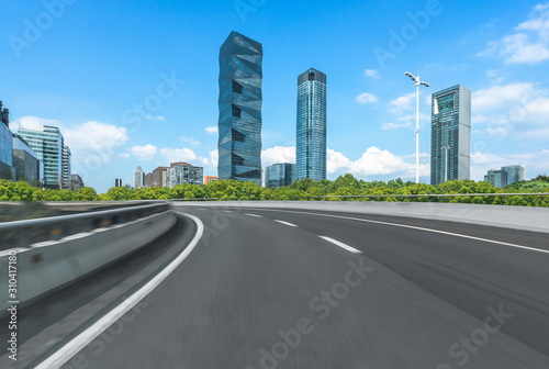 urban traffic road with cityscape in background, China.