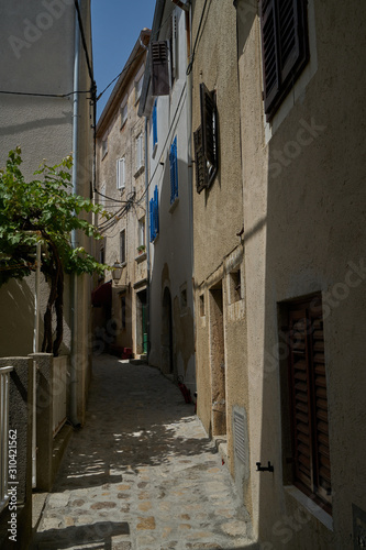A pedestrian alley in the city of vrbnik