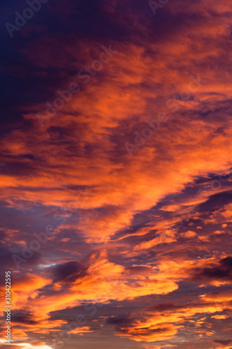 Colorful twilight red and black dramatic sunset sky © annatronova