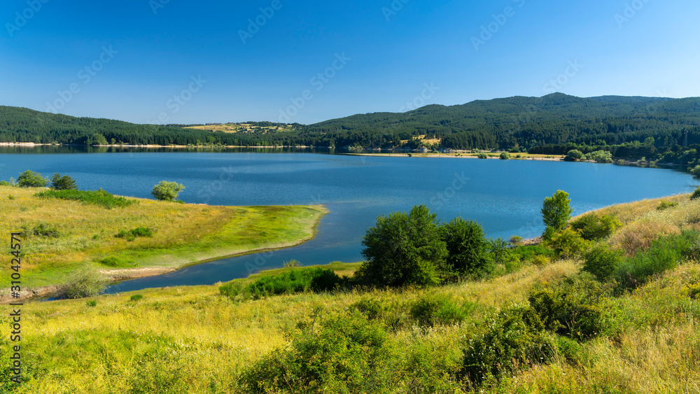 Summer landscape along the road to Camigliatello, Sila. Cecita lake