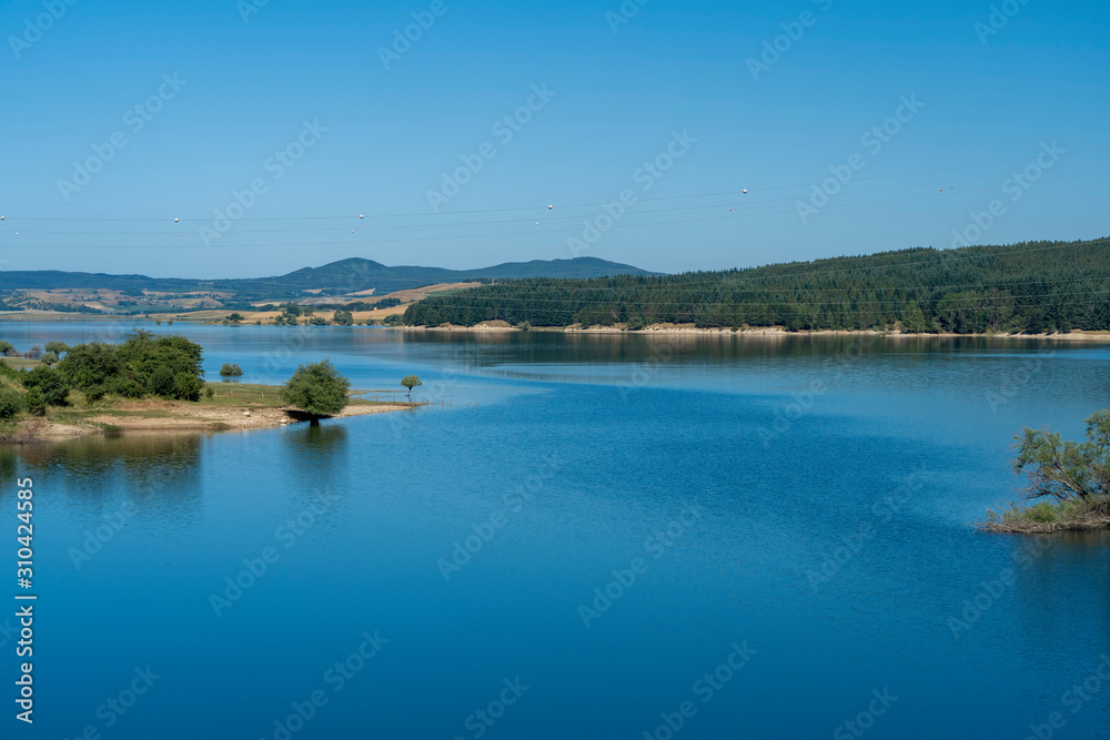 Summer landscape along the road to Camigliatello, Sila. Cecita lake