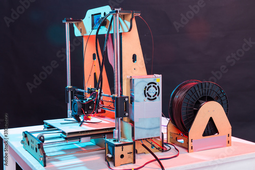 Electronic three dimensional plastic printer during work in laboratory, 3D printer, 3D printing photo