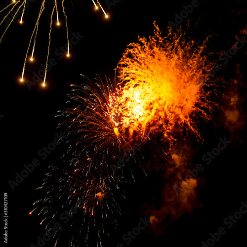 Fireworks, salute. With the black sky background . Abstract holiday backgrounds