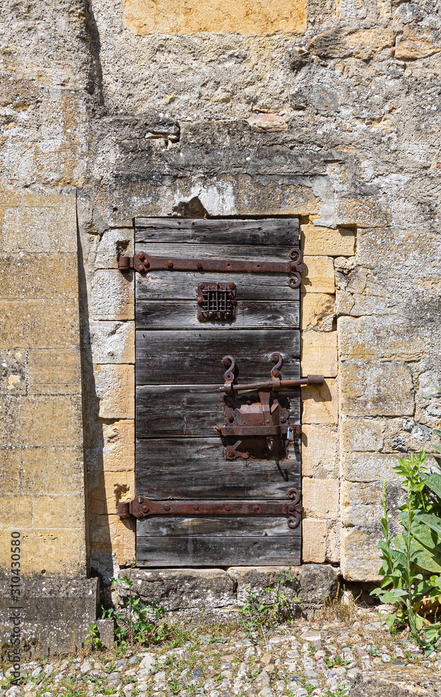 Door. Wooden. Rusty. Stone. Wall