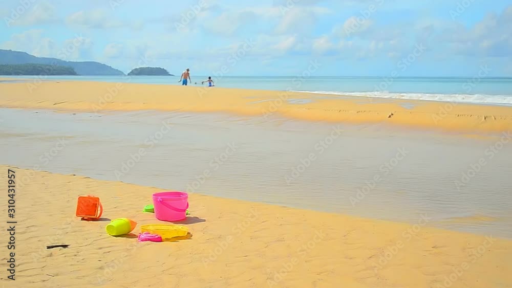 Colorful toy on tropical beach and blue sky white cloud background Colorful toy on tropical beach and blue sky white cloud background