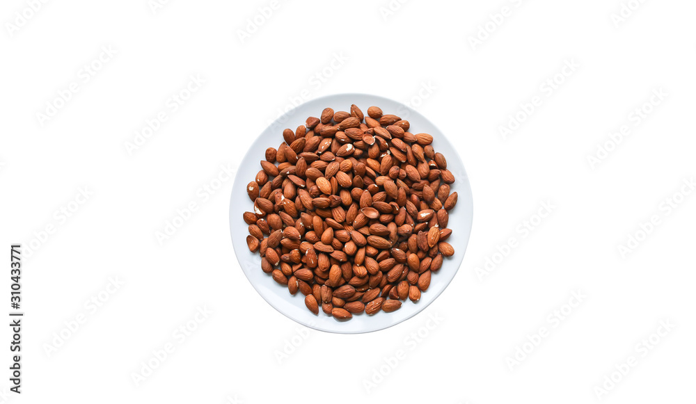 Almond lying on the plate isolated on white background. Healthy food. Vegan concept. Lifestyle. Nuts background. Copy space place. Almond lying on the plate isolated on white background. Healthy food. Vegan concept. Lifestyle. Nuts background. Copy space place.