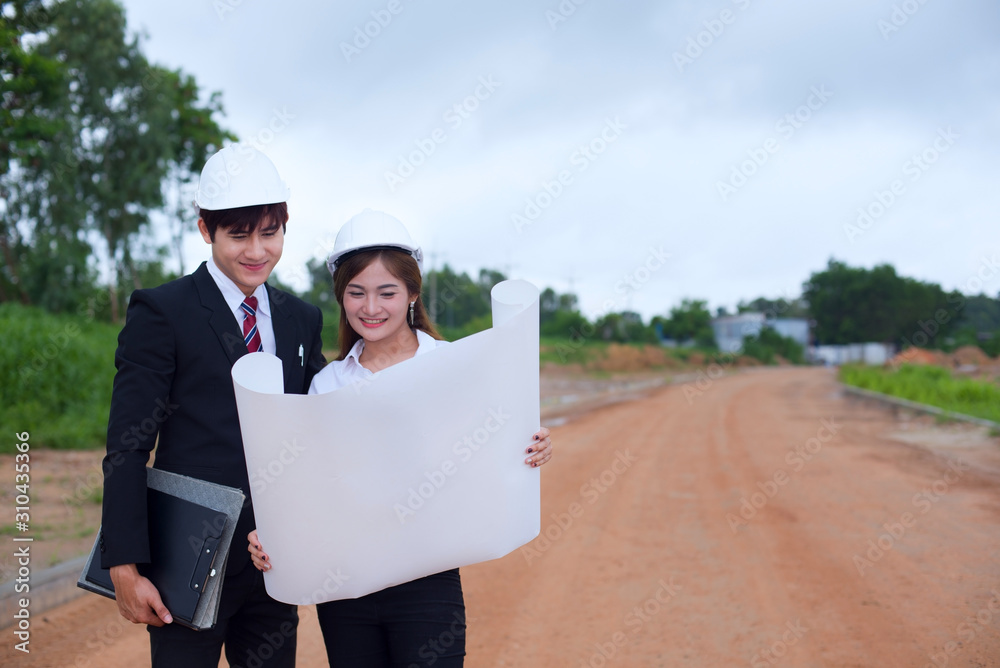 Engineers architect meeting design project wearing a jeans shirt reading blueprint design project concept at construction site. Engineers architect meeting design project wearing a jeans shirt reading blueprint design project concept at construction site.