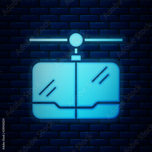 Glowing neon Cable car icon isolated on brick wall background. Funicular sign.  Vector Illustration