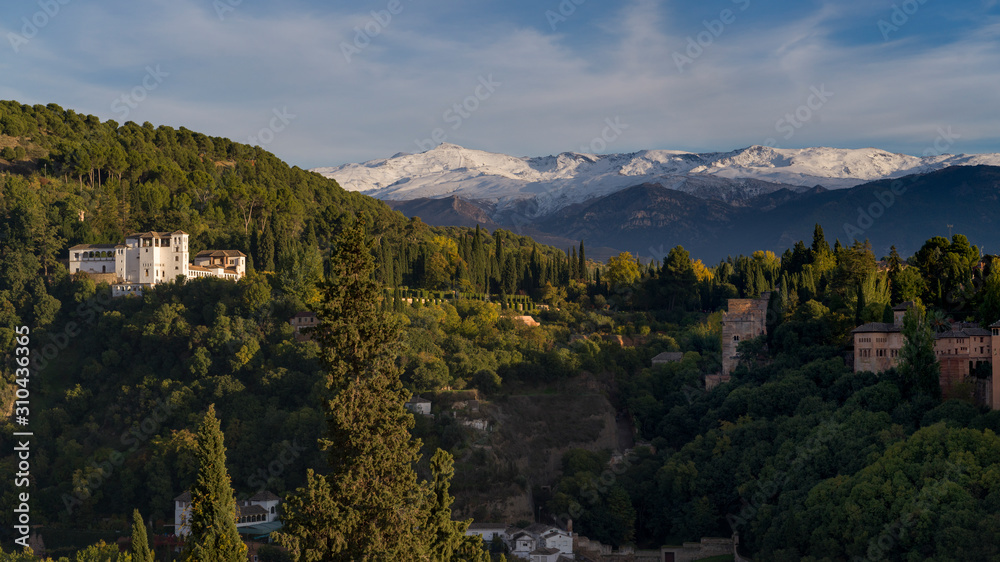 View of town with snowcapped mountain in the background, Granada, Spain