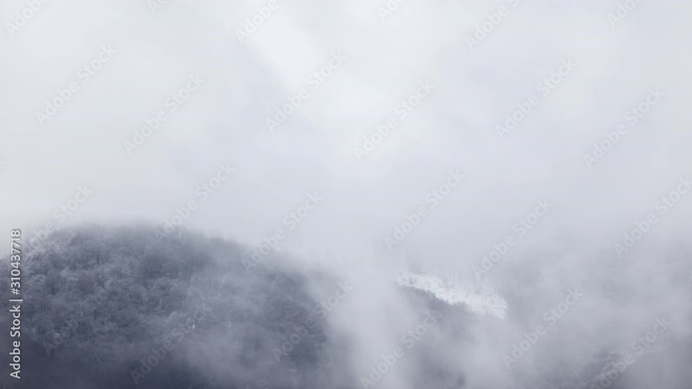 Time lapse of a mountain landscape in winter, with snow and cloudy passes. Time lapse of a mountain landscape in winter, with snow and cloudy passes.