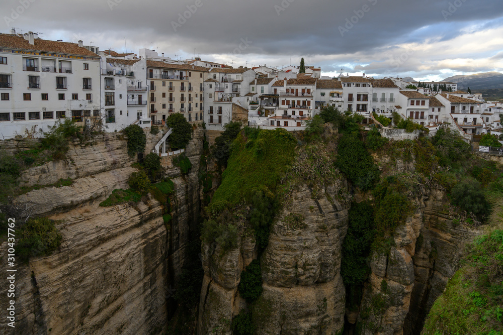 View of townscape atop of canyon cliff of Ronda, Malaga Province, Spain