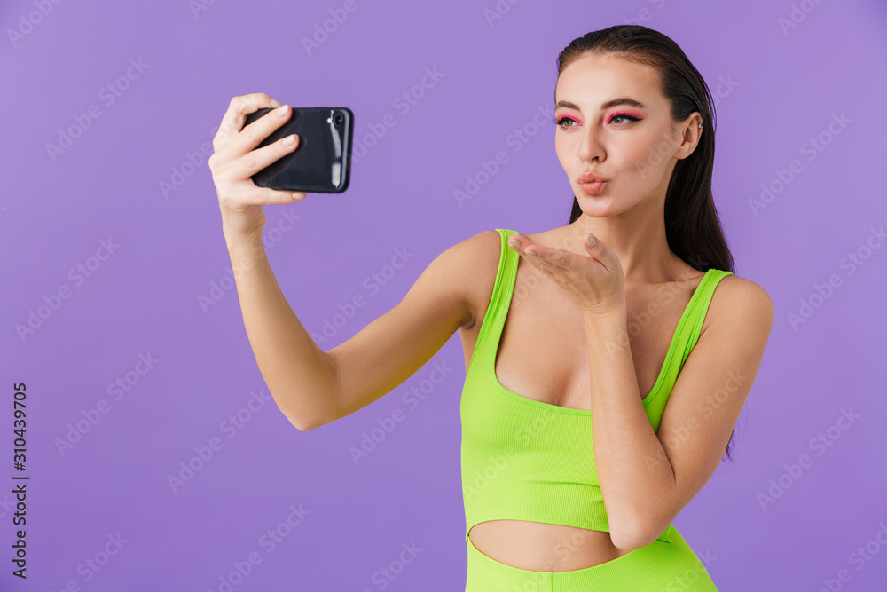 Photo of cute young woman taking selfie photo on smartphone Photo of cute young woman taking selfie photo on smartphone