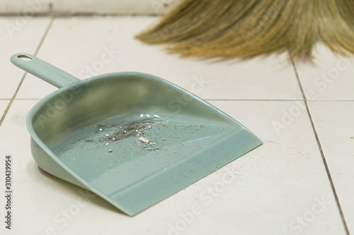 Dust in the gray plastic dustpan