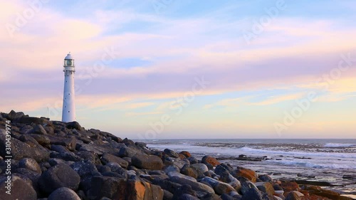 Slangkop Lighthouse near the town of Kommetjie in Cape Town, South Africa at Sunset