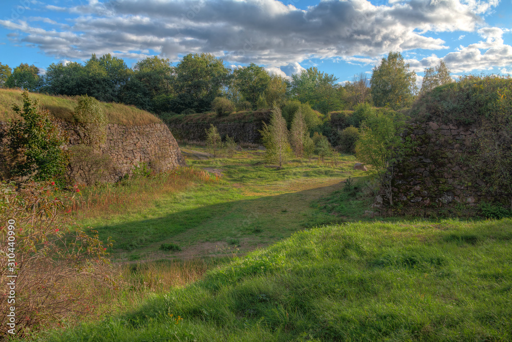 Stone walls and moats covered by the grass in Annenkrone in sunny day in HDR processing, Vyborg, Leningrad Oblast, Russia