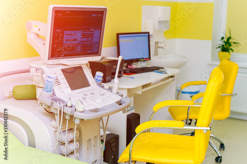 Interior of examination room with ultrasonography machine in hospital. Sonography. Health tests concept. Closeup