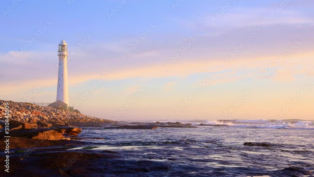 Slangkop Lighthouse near the town of Kommetjie in Cape Town, South Africa at Sunset