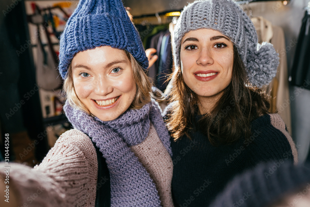 Two joyful cheerful girls taking a selfie Two joyful cheerful girls taking a selfie