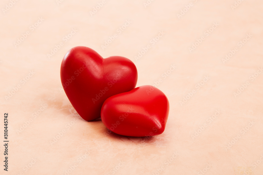 Two red hearts on Pink background