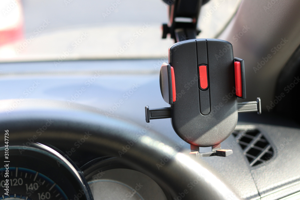 Mobile phone holder on the car for safety while driving a vehicle. Mobile phone holder on the car for safety while driving a vehicle.
