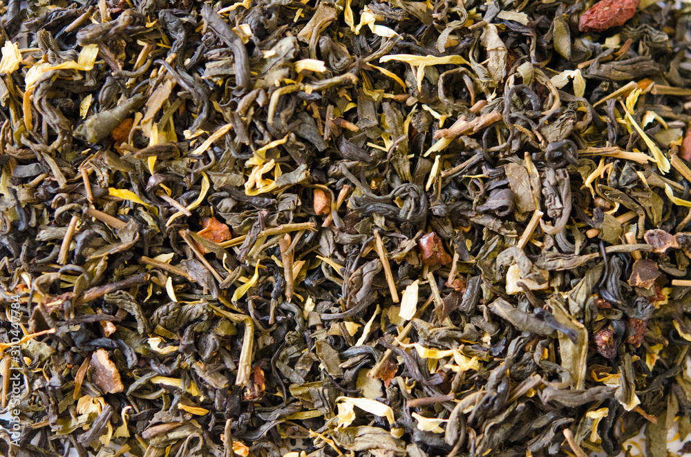 Green tea with additives closeup on white background. Proper nutrition, healthy tonic drink. Green tea with additives closeup on white background. Proper nutrition, healthy tonic drink.