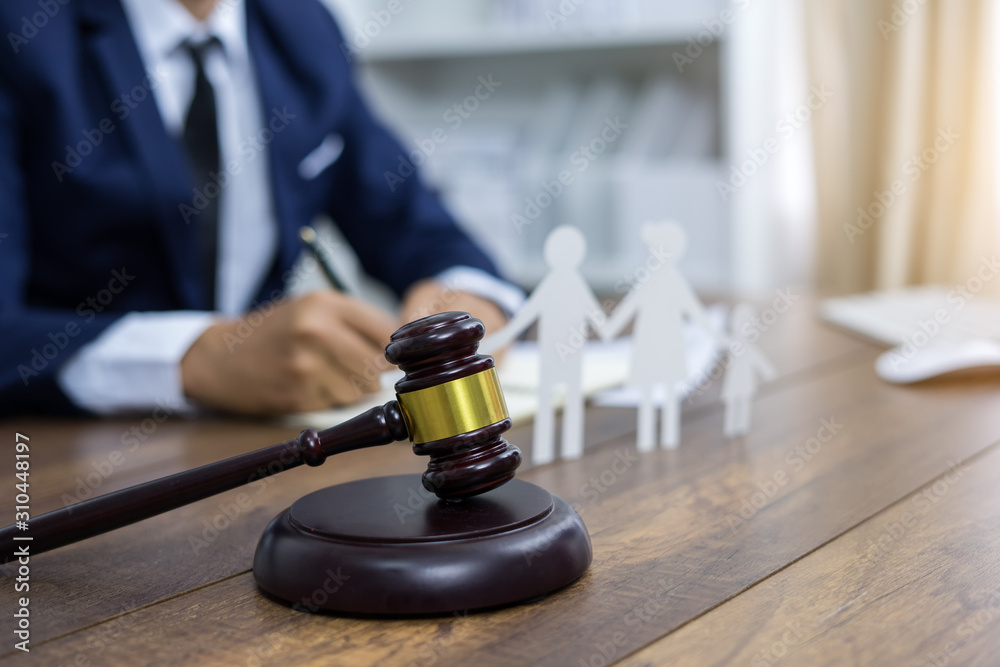 Family figure and gavel on table. Family law concept Family figure and gavel on table. Family law concept