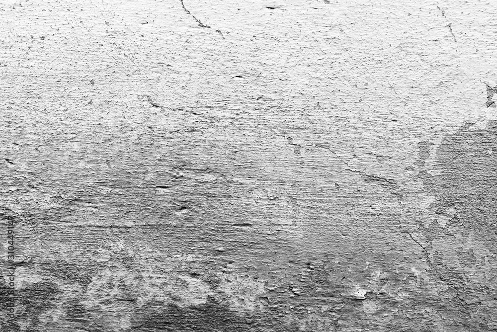 Texture of a concrete wall with cracks and scratches which can be used as a background Texture of a concrete wall with cracks and scratches which can be used as a background
