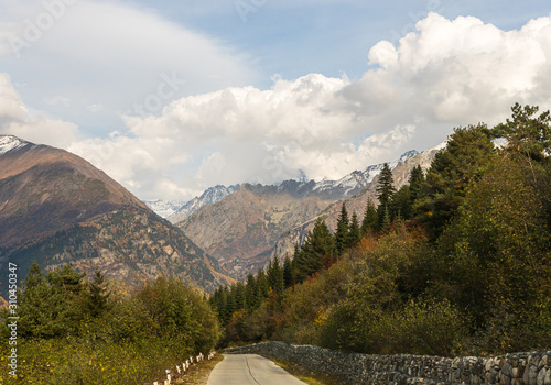 The mountain road runs between the mountains in Svaneti in the mountainous part of Georgia