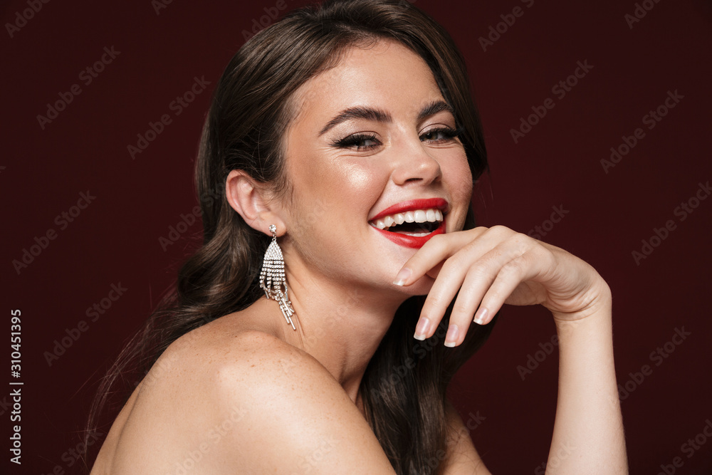 Image of joyful shirtless woman laughing and looking at camera Image of joyful shirtless woman laughing and looking at camera