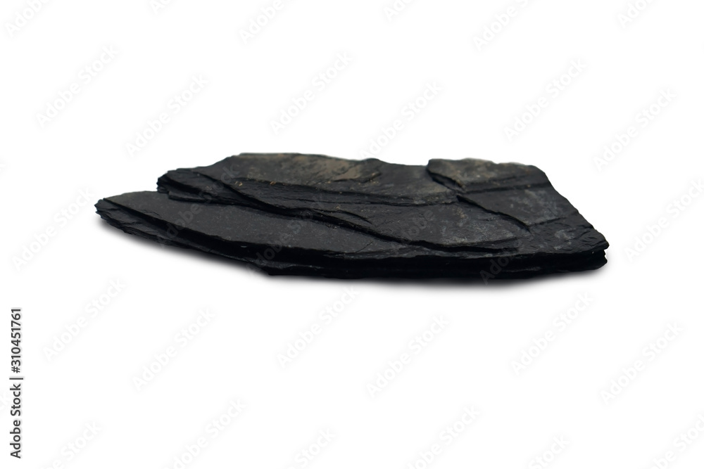 slate rock isolated on white background. There is noise and grain caused by  the texture of the stone. Slate is a foliated metamorphic rock that forms  from the metamorphism of shale. Stock
