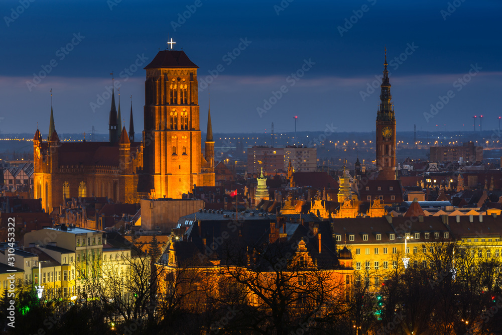Beautiful cityscape of Gdansk with St. Mary Basilica and City Hall at dawn, Poland.