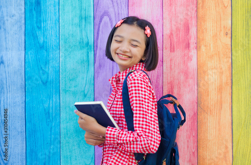 Happy young student asia girl with colorful background. photo