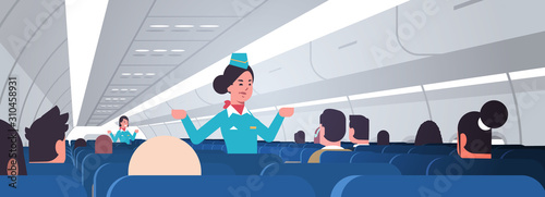 stewardess explaining instructions for passengers female flight attendants in uniform showing emergency exits safety demonstration concept airplane board interior horizontal vector illustration