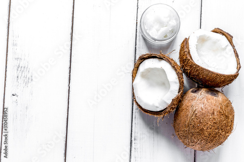 organic cosmetics with coconut on white background top view