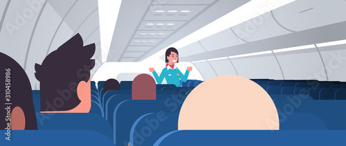 stewardess explaining instructions for passengers female flight attendant in uniform showing emergency exits safety demonstration concept airplane board interior horizontal vector illustration