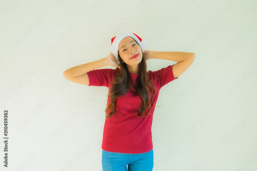 Portrait beautiful young asian women wearing santa hat for celebration in christmas Portrait beautiful young asian women wearing santa hat for celebration in christmas