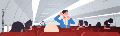 steward explaining for passengers how to use oxygen mask in emergency situation male flight attendants safety demonstration concept modern airplane board interior horizontal vector illustration