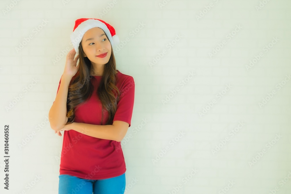 Portrait beautiful young asian women wearing santa hat for celebration in christmas Portrait beautiful young asian women wearing santa hat for celebration in christmas