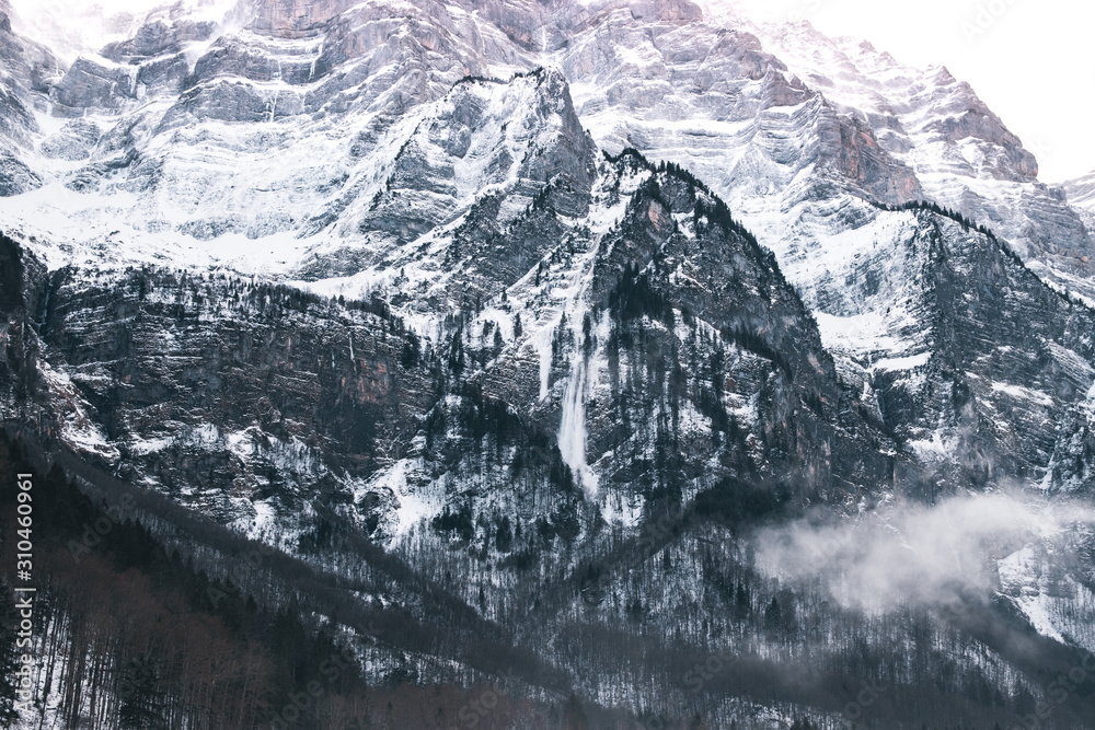 Fototapeta premium Snow Mountains Cover In Fog, Switzerland.