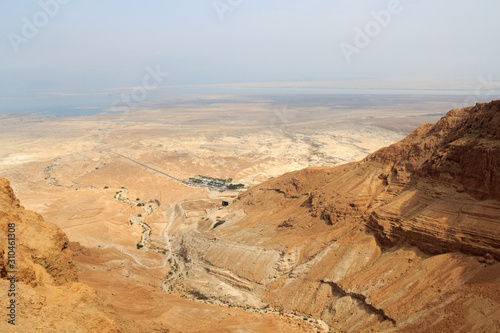 Judaean Desert panorama with wadis and salt lake dead sea seen from Masada fortress, Israel