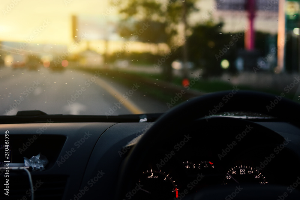 Man driving car from rear view on the highway With sunlight.