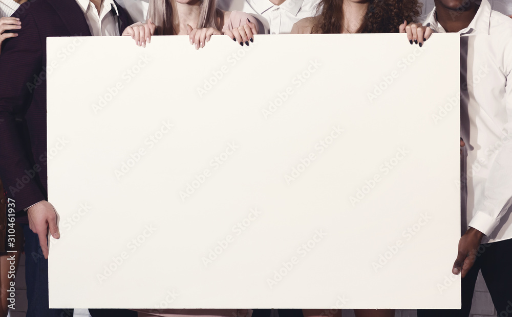 Unrecognizable Young People Holding Blank White Poster Standing Indoor ...