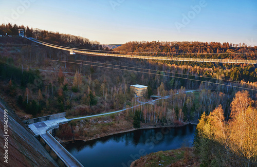 View from the Rappbodetalsperre to the Titan RT bridge over the Bode. The longest pedestrian suspension bridge on earth at the Rappbode dam.