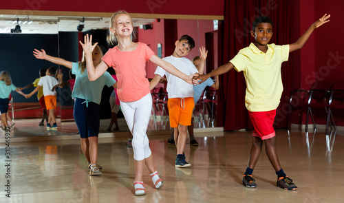 Children trying dancing partner dance