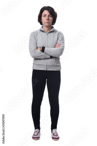 full length portrait of a woman arms crossed on white background,serious,