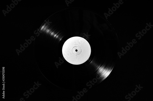 78 rpm vinyl disk on dark background photo