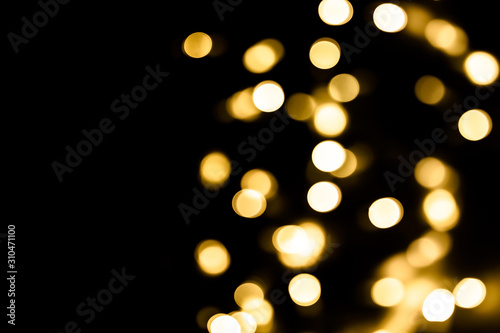 Festive overlay effect. Golden circles bokeh festive glitter dark background. Christmas, New Year, holidays design. Copy space