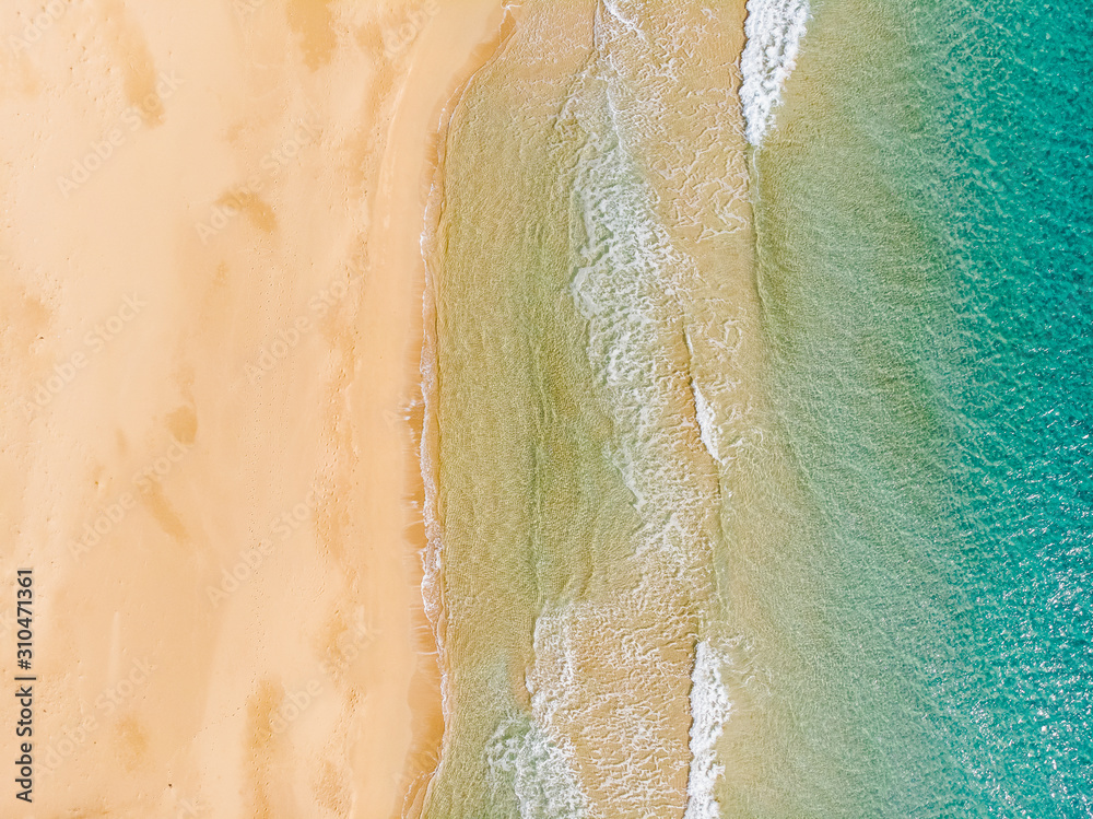 Amazing Beach and waves from top view. Turquoise water background. Summer seascape from air. Summer Background. Top view from drone. Travel concept and idea. North Cyprus, Golden Beach. Amazing Beach and waves from top view. Turquoise water background. Summer seascape from air. Summer Background. Top view from drone. Travel concept and idea. North Cyprus, Golden Beach.