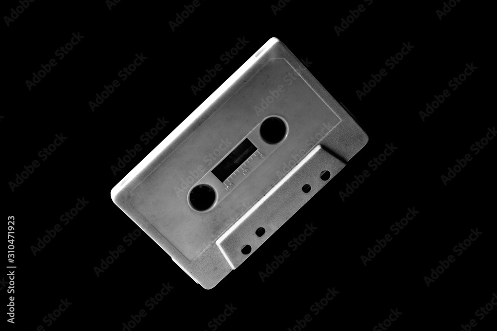 Obraz premium white audio cassette on dark background